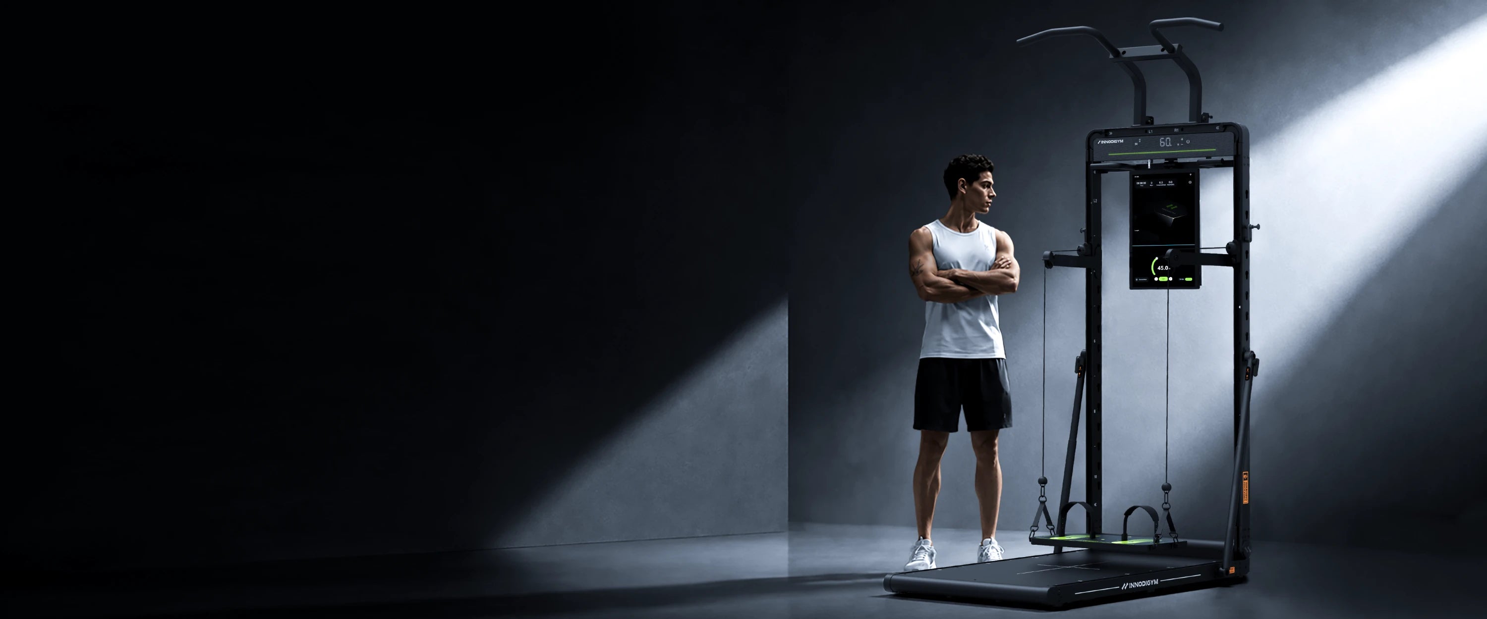 Athlete standing beside the INNODIGYM OMNI X1 home gym